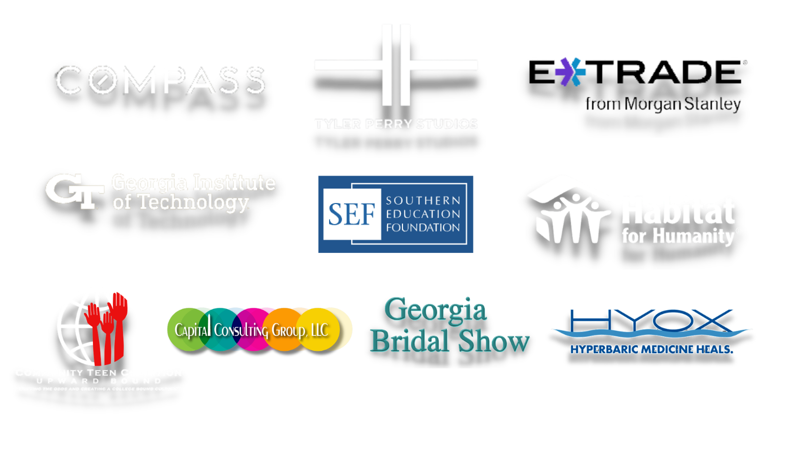 Client logos including Compass, Tyler Perry Studios, E*TRADE from Morgan Stanley, Georgia Institute of Technology, Southern Education Foundation, and Habitat for Humanity